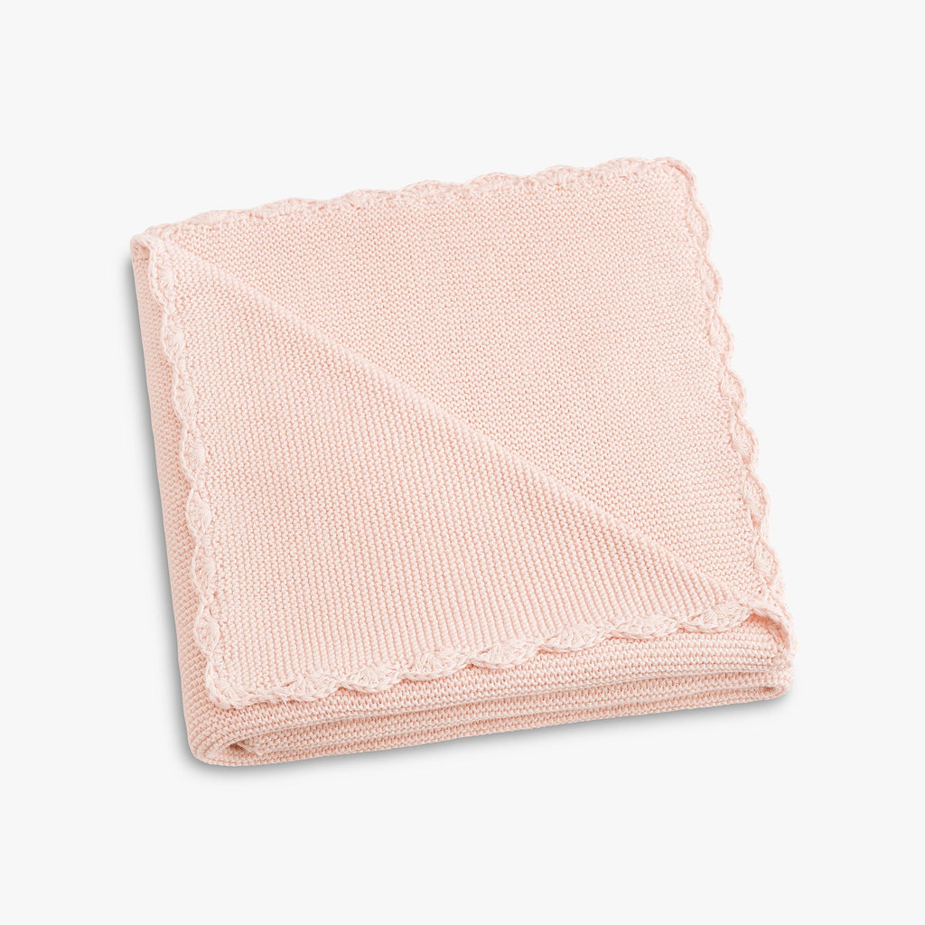 Cotton Knit Baby Blanket in Pink folded to show trim detail