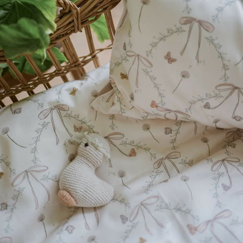 Bows & Butterfly Kisses Baby Duvet in Pink displayed in Moses Basket