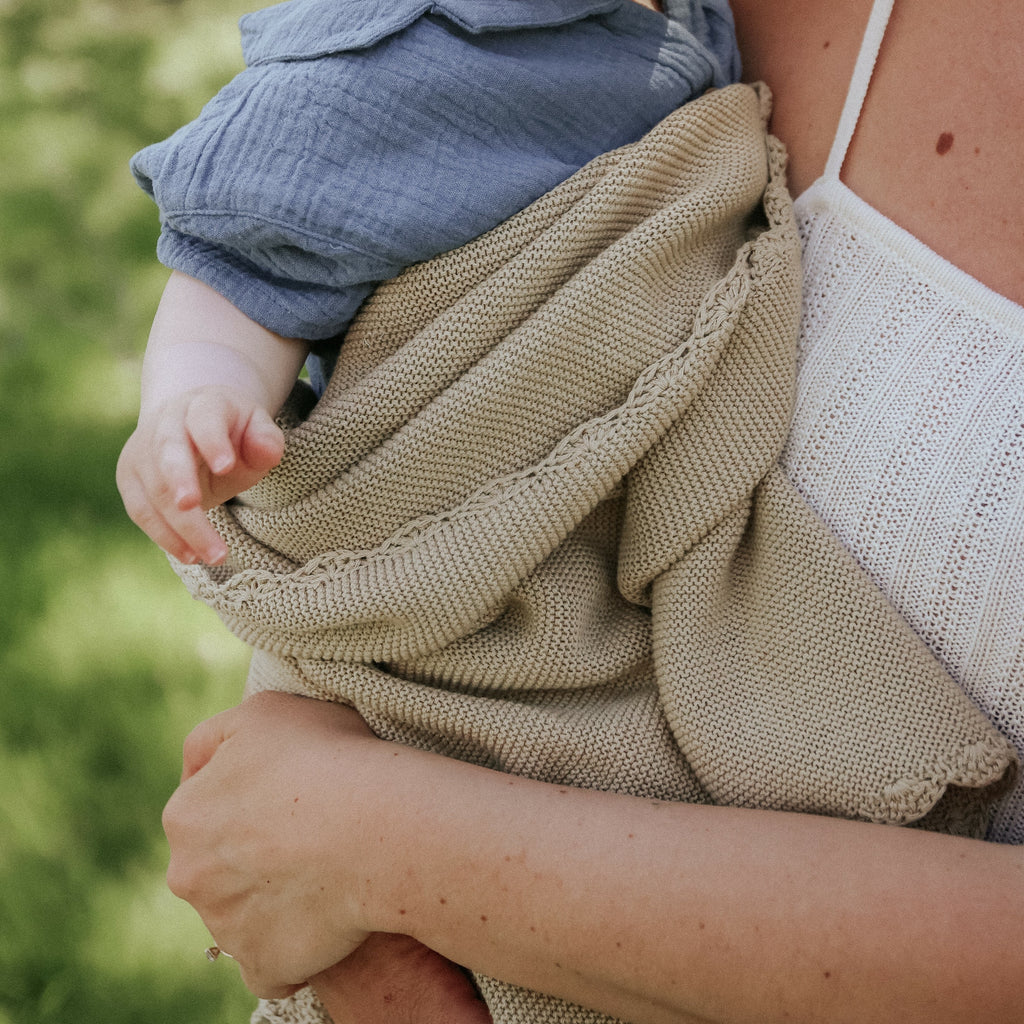 Baby and Mother with the Cotton Knit Baby Blanket in Beige