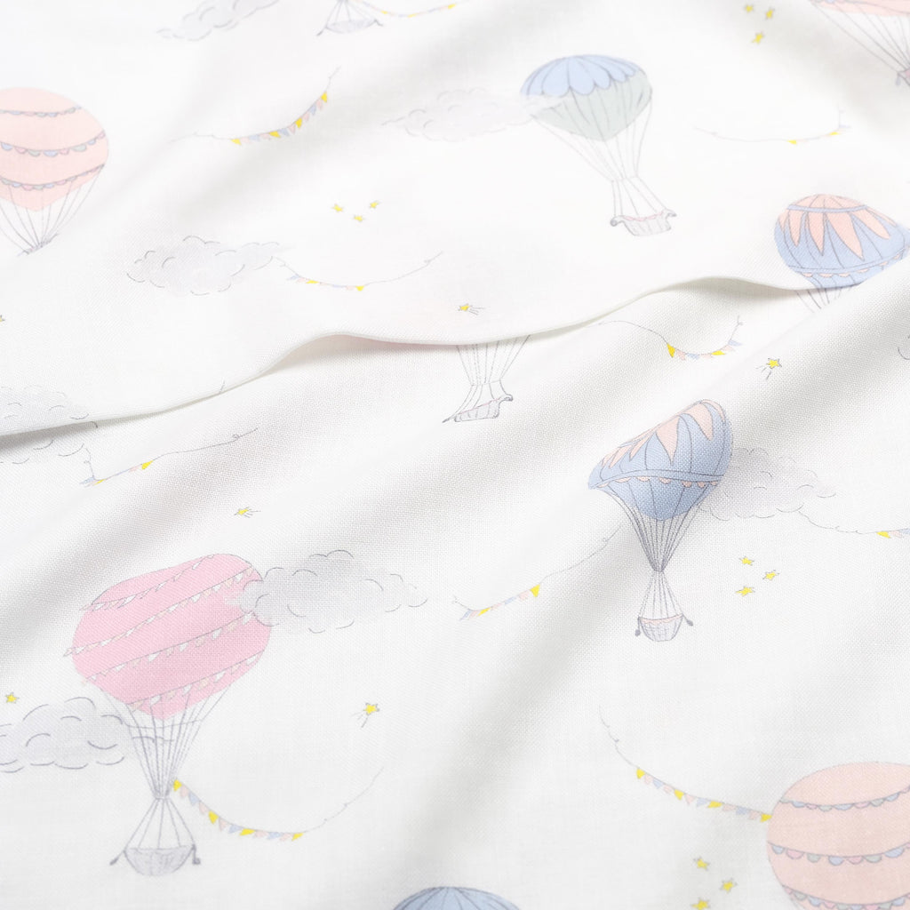 Touch The Sky Swaddle Blanket in Pink.