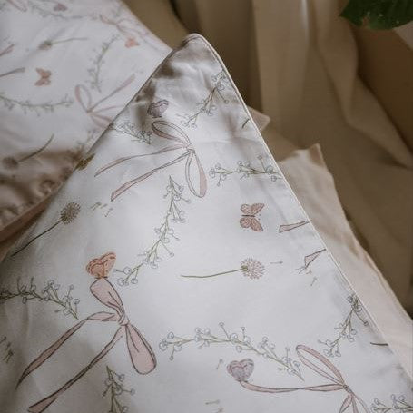 Upclose details of the bow print in standard pillowcase in pink