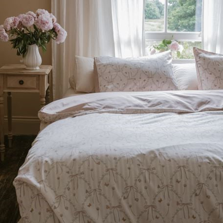 Bow Print in a Full Bed with Florals on the side of the bed