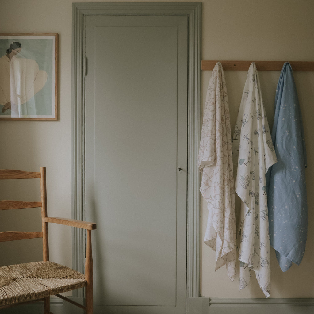 Swaddle Blanket hanging in a room 